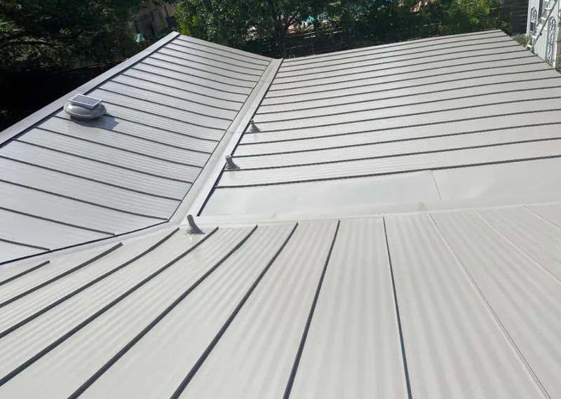 Solar attic fan installed on a metal roof for Roof Ventilation in Carolina Beach